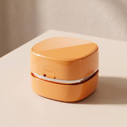 CleanPod Mini Desk Vacuum in orange