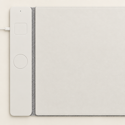 The VoltDesk charging panel beside the mat, running the full height of the mat's short edge